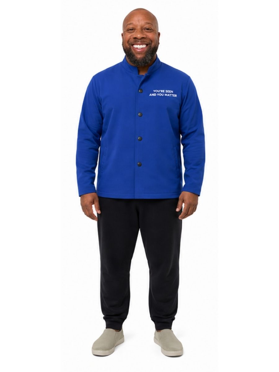 Adult wearing QUPPL weighted jacket in royal blue color showing front view.