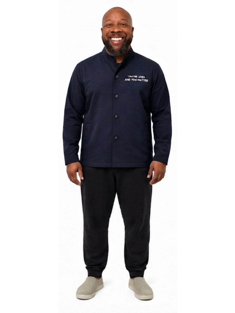 Adult wearing QUPPL weighted jacket in dark navy color showing front view.