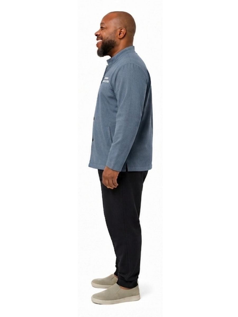 Adult wearing QUPPL weighted jacket in deep sky blue color showing side view.