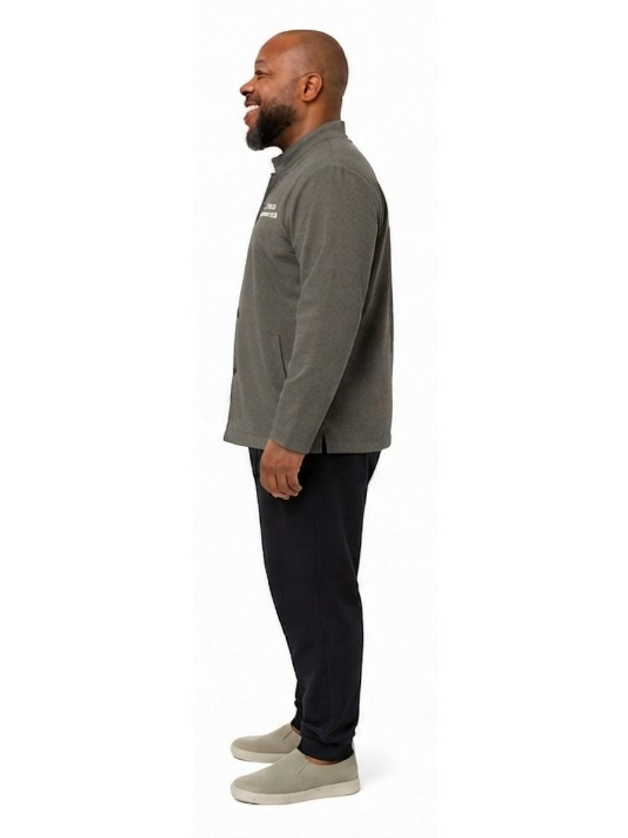 Adult wearing QUPPL weighted jacket in charcoal grey color showing side view.