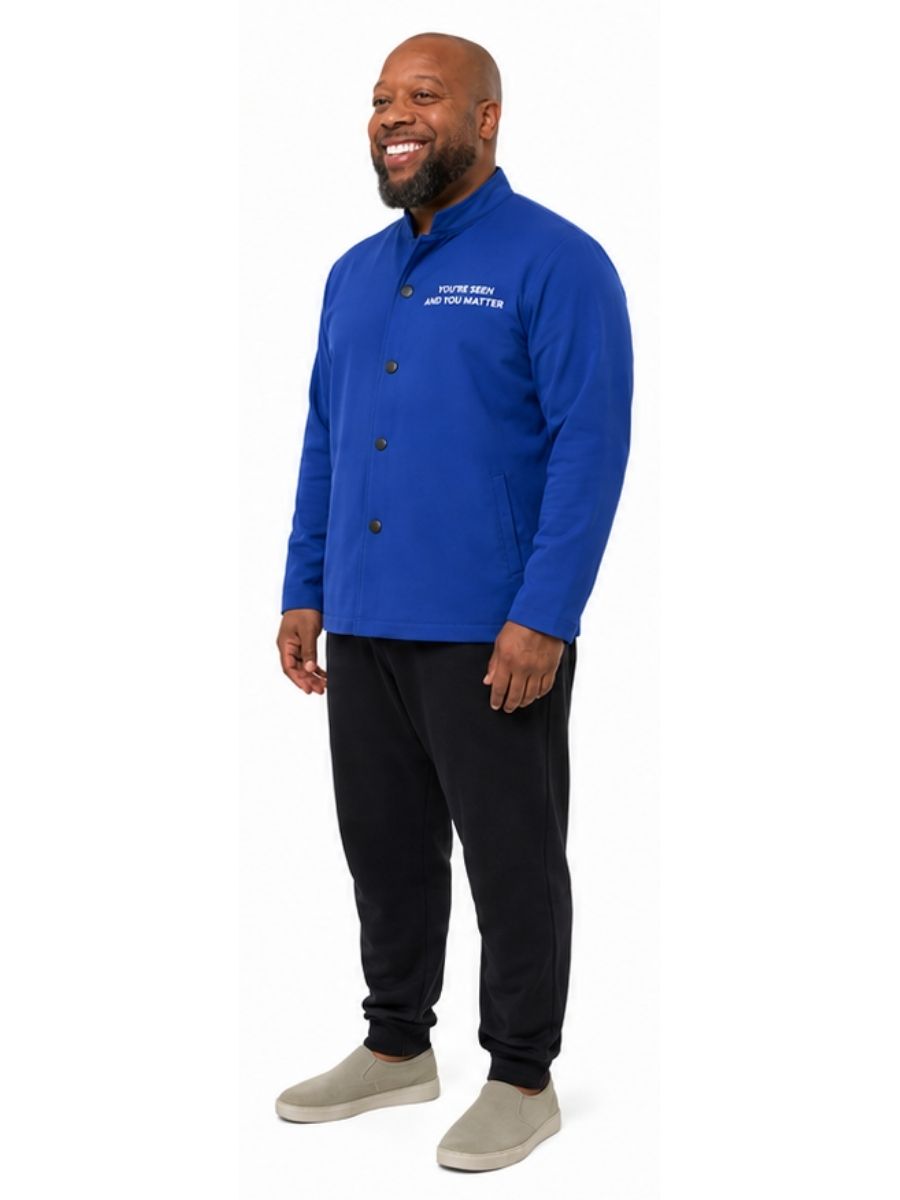 Adult wearing QUPPL weighted jacket in royal blue color showing 45 degree view.